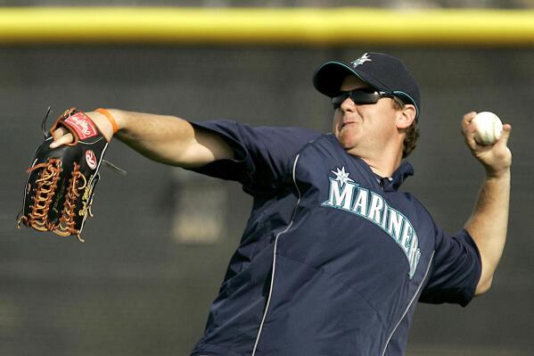 FILE - Seattle Mariners outfielder Brad Wilkerson throws the ball during baseball spring training at the team's complex in Peoria, Ariz., Feb. 18, 2008. Former big leaguer Brad Wilkerson was hired as the New York Yankees' assistant hitting coach on Monday, Jan. 30, 2023. (AP Photo/Charlie Riedel, File)