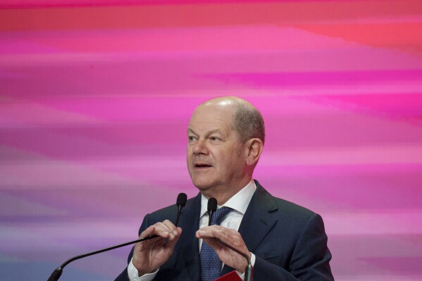 German Chancellor Olaf Scholz speaks during the Party of European Socialists (PES) Leaders Conference, at the Palace of the Parliament, the second largest administrative building in the world after the Pentagon, in Bucharest, Romania, Saturday, April 6, 2024. (AP Photo/Andreea Alexandru)