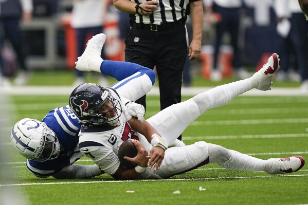 Indianapolis Colts defensive end Jake Martin (92) sacks Houston Texans quarterback C.J. Stroud (7) in the second half of an NFL football game in Houston, Sunday, Sept. 17, 2023. (AP Photo/David J. Phillip)