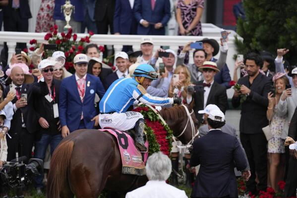 Javier Castellano, atop Mage, reacts in the winner's circle after winning the 149th running of the Kentucky Derby horse race at Churchill Downs Saturday, May 6, 2023, in Louisville, Ky. (AP Photo/Jeff Roberson)