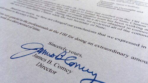 FILE - Part of a Nov. 6, 2016, letter from FBI Director James Comey to Congress is photographed in Washington on Nov. 6, 2016. Comey told Congress that a review of new Hillary Clinton emails has "not changed our conclusions" from earlier this year that she should not face charges. (AP Photo/Jon Elswick, File)