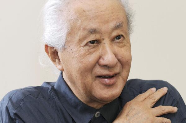 FILE- Architect Arata Isozaki is interviewed in 2013. Isozaki, a Pritzker-winning Japanese architect known as a post-modern giant who blended culture and history of the East and the West in his designs, has died of old age. He was 91. (Kyodo News via AP, File)