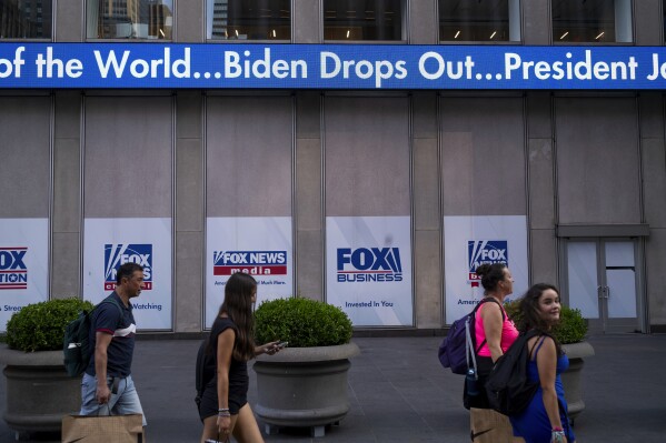 A news crawl appears on the side of the Fox News building in New York, Sunday, July 21, 2024, in the wake of President Joe Biden dropping out of the 2024 race for the White House. (AP Photo/Craig Ruttle)