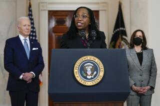 Judge Ketanji Brown Jackson speaks after President Joe Biden announced Jackson as his nominee to the Supreme Court in the Cross Hall of the White House, Friday, Feb. 25, 2022, in Washington. Vice President Kamala Harris listens as right. (AP Photo/Carolyn Kaster)