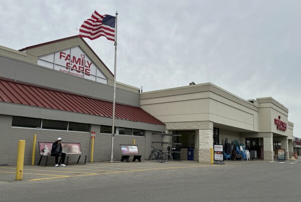 A Family Fare store is shown in Midland, Mich., Thursday, May 9, 2024. Contractors curious about an extension cord on the roof of a Michigan grocery store made a startling discovery: A 34-year-old woman was living inside the business sign, with enough space for a computer, printer and coffee maker, police said. (Dave Clark/Midland Daily News via AP)