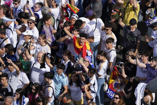 Real Madrid supporters celebrate in Cibeles Square a week after their team clinched La Liga title in Madrid, Spain, Sunday, May 12, 2024. (AP Photo/Paul White)