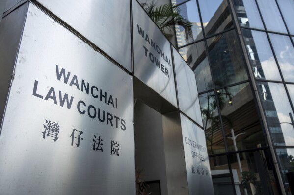 The sign for the Wan Chai Distict Court where the sentences for four former University of Hong Kong student leaders were handed down in Hong Kong, Monday, Oct. 30, 2023. Four former student leaders from the University of Hong Kong have been sentenced to two years in prison for inciting people to wound others through their praise of a man who stabbed a police officer before killing himself in 2021. (AP Photo/Vernon Yuen)