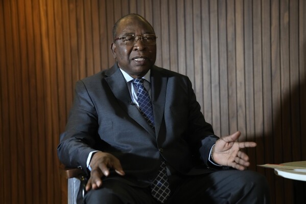 Niger Prime Minister Ouhoumoudou Mahamadou answers the Associated Press, Tuesday, Aug. 1, 2023 in Paris. France prepared to evacuate French and other European nationals from Niger on Tuesday, telling them to carry no more than a small bag, after a military coup there won backing from three other West African nations ruled by mutinous soldiers. (AP Photo/Christophe Ena)