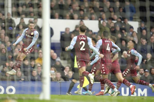Aston Villa's Emiliano Buendia, left, celebrates after scoring his side's first goal during the English Premier League soccer match between Everton and Aston Villa at the Goodison Park stadium, in Liverpool, England, Saturday Jan. 22, 2022. (AP Photo/Jon Super)