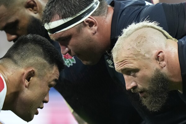 England's Joe Marler, right looks at his counterpart Japan's Jiwon Gu as a scrum is about to bind during the Rugby World Cup Pool D match between England and Japan in the Stade de Nice, in Nice, France Sunday, Sept. 17, 2023. (AP Photo/Pavel Golovkin)