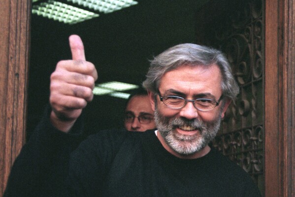FILE - This is an undated file photo of Slavko Curuvija the owner and editor of two independent newspapers at the time, was gunned down on April 11, 1999, in Belgrade, Serbia. Media rights groups and opposition campaigners have condemned a Serbian appeals court ruling that acquitted four former intelligence officers who were jailed for the killing of a prominent editor and newspaper publisher. Slavko Curuvija was shot dead at the entrance to his Belgrade apartment during the 1999 NATO bombing of Serbia over its crackdown against Kosovo Albanian separatists. (AP Photo/Pedja Milosavljevic, File)