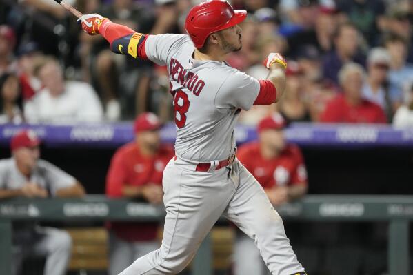 St. Louis Cardinals' Nolan Arenado watches his solo home run off Colorado Rockies relief pitcher Austin Gomber during the sixth inning of a baseball game Wednesday, Aug. 10, 2022, in Denver. (AP Photo/David Zalubowski)