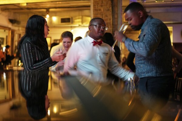 Diners dance along as the resident band performs at The Marabi Club in downtown Johannesburg, South Africa, Friday, May 9, 2025. (AP Photo/Themba Hadebe)