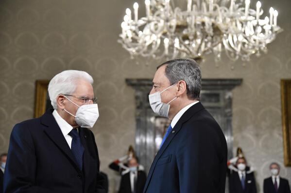 FILE - Italy's President Sergio Mattarella, left, greets Italy's Prime Minister Mario Draghi at the Quirinale presidential palace in Rome, Friday, Nov. 26, 2021, ahead of the French President visit. Draghi met Monday, July 11, 2022 with Italy’s president to discuss the future of his government amid simmering tensions with coalition member 5-Star Movement. (Alberto Pizzoli/Pool photo via AP, File)