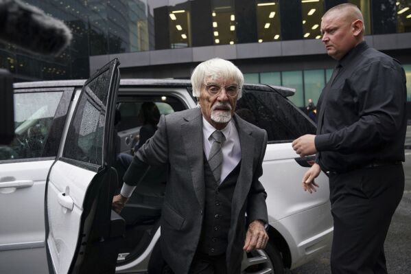 Former Formula One boss Bernie Ecclestone, left, arrives at Southwark Crown Court in London, on Thursday Oct.12, 2023. (Lucy North/PA via AP)