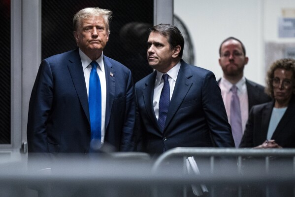 Former President Donald Trump and attorney Todd Blanche return from a lunch break in his trial at Manhattan criminal court in New York on Thursday, April 18, 2024. (Jabin Botsford/The Washington Post via AP, Pool)