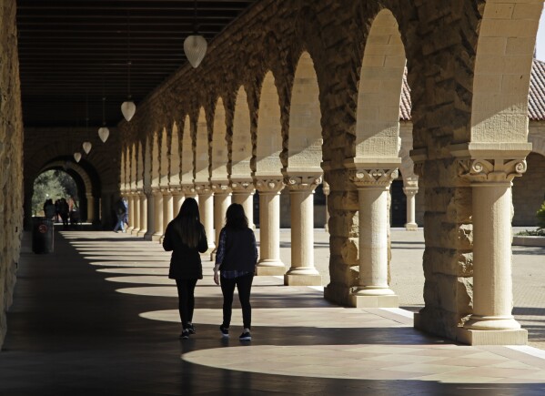 FILE - In this March 14, 2019, file photo students walk on the Stanford University campus in Santa Clara, Calif. A new study from the State Department and the Institute of International Education finds that international students in the U.S. grew by 12% in the 2022-23 academic year, the largest jump in more than 40 years. More than 1 million students came from abroad, the most since the 2019-20 school year. (AP Photo/Ben Margot, File)