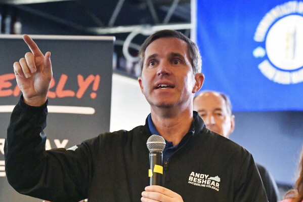 Kentucky Governor and Democratic candidate for re-election Andy Beshear speaks to supporters during a stop of his statewide bus tour in Richmond, Ky., Monday, Oct. 30, 2023. (AP Photo/Timothy D. Easley)