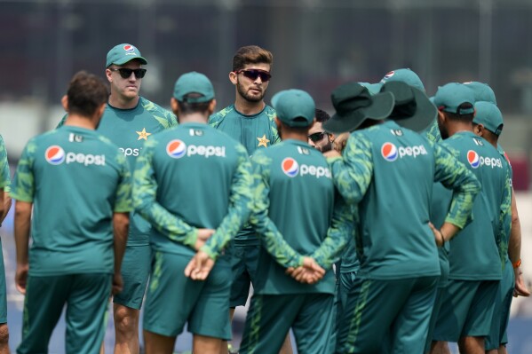 Pakistan's team coach Mickey Arthur, left facing camera, talks with the team ahead of their ICC Men's Cricket World Cup match against Afghanistan in Chennai, India, Monday, Oct. 23, 2023. (AP Photo/Eranga Jayawardena)