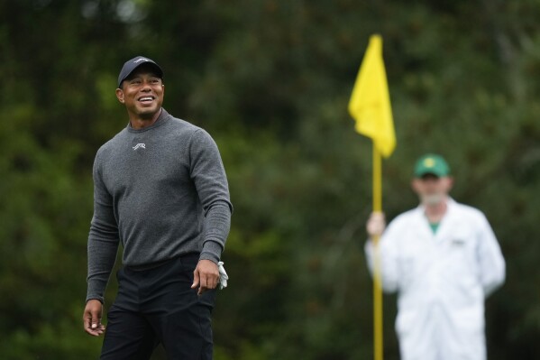 Tiger Woods smiles on on the fifth green during a practice round in preparation for the Masters golf tournament at Augusta National Golf Club Tuesday, April 9, 2024, in Augusta, Ga. (AP Photo/Matt Slocum)