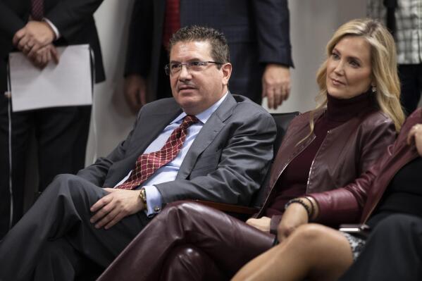 FILE - Washington Redskins owner Dan Snyder, left, and his wife Tanya Snyder, listen to head coach Ron Rivera during a news conference at the team's NFL football training facility in Ashburn, Va., in this Thursday, Jan. 2, 2020, file photo. Few NFL teams have managed to lose as much as Washington has since Daniel Snyder was part of a group that purchased the franchise for a then-record $800 million in 1999. (AP Photo/Alex Brandon, File)