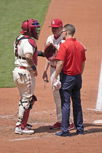 St. Louis Cardinals catcher Yadier Molina runs into Cincinnati