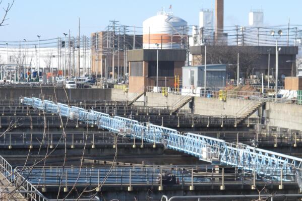 FILE - This Jan. 11, 2022 file photo, shows part of the Passaic Valley Sewerage Authority plant in Newark N.J. A proposed backup power plant for the facility is drawing strenuous opposition from residents who say their neighborhood is already overburdened with polluting facilities, including two other power plants. Officials with the state Department of Environmental Protection said Thursday, June 2, 2022, they hope to have rules spelling out the details of the law approved by Dec. 31, which would mark the point where the law was fully implemented. (AP Photo/Wayne Parry, File)