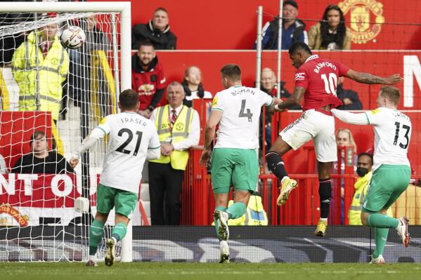 Manchester United's Marcus Rashford, second right, makes an attempt to score during the English Premier League soccer match between Manchester United and Newcastle at Old Trafford stadium in Manchester, England, Sunday, Oct. 16, 2022. (AP Photo/Dave Thompson)