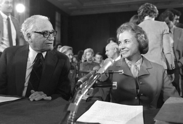 FILE - Sen. Barry Goldwater, R-Ariz., and Supreme Court nominee Judge Sandra Day O'Connor, talk prior to the start of her confirmation hearings before the Senate Judiciary Committee on Capitol Hill, Sept. 9, 1981. O'Connor, who joined the Supreme Court in 1981 as the nation's first female justice, has died at age 93. (AP Photo)