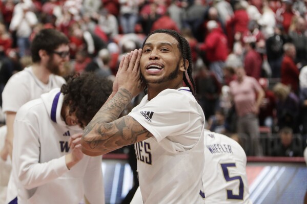 Washington guard Koren Johnson gestures to Washington State fans after an NCAA college basketball game, Thursday, March 7, 2024, in Pullman, Wash. (AP Photo/Young Kwak)