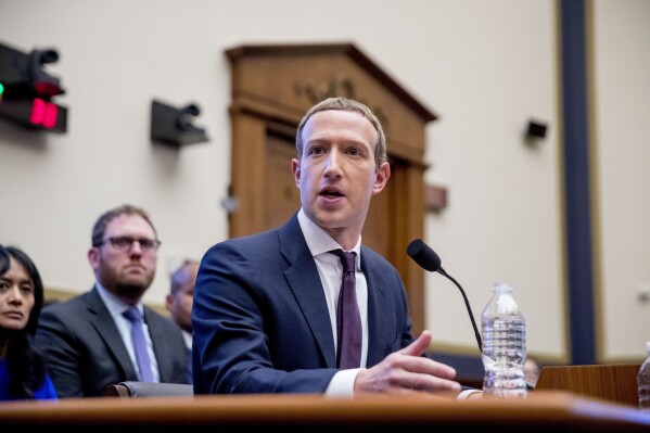 FILE - Facebook CEO Mark Zuckerberg testifies before a House Financial Services Committee hearing on Capitol Hill in Washington, Oct. 23, 2019. Meta's Oversight Board said Monday, Feb. 5, 2024, that it is urging the company to clarify its approach to manipulated media so its platforms can better beat back the expected flood of online election disinformation this year. The recommendations come after the board reviewed an altered video of President Joe Biden that was misleading but didn't violate the company's policies. (APPhoto/Andrew Harnik)