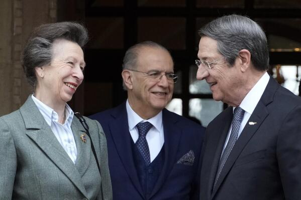 Britain's Princess Anne, left, talks with Cyprus' President Nicos Anastasiades, right, as Cyprus' Foreign Minister Ioannis Kasoulides is seen in the background, after their meeting at the presidential palace in Nicosia, Cyprus, Wednesday, Jan. 11, 2023. Princess Anne visited British soldiers serving with a United Nations peacekeeping force on ethnically divided Cyprus. (AP Photo/Petros Karadjias)