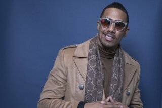 FILE - In this Dec. 10, 2018, file photo Nick Cannon poses for a portrait in New York. Cannon's “hateful speech” and anti-Semitic conspiracy theories led ViacomCBS to cut ties with the performer, the media giant said. “ViacomCBS condemns bigotry of any kind and we categorically denounce all forms of anti-Semitism," the company said in a statement Tuesday, July 14, 2020. It is terminating its relationship with Cannon, ViacomCBS said. (Photo by Amy Sussman/Invision/AP, File)