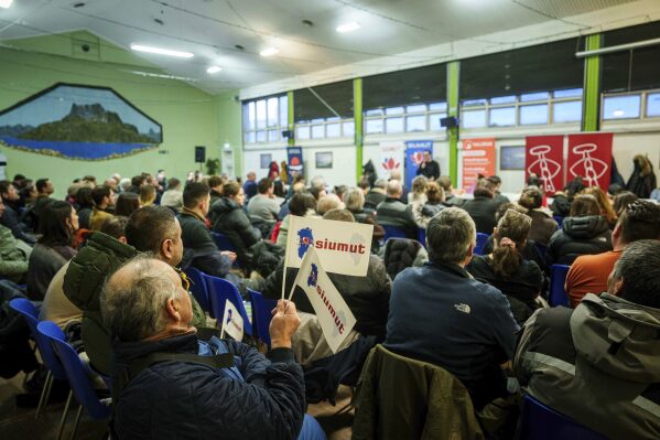 People listen speeches of candidates for upcoming parliamentary elections in Nuuk, Greenland, March 5, 2025. (AP Photo/Evgeniy Maloletka)