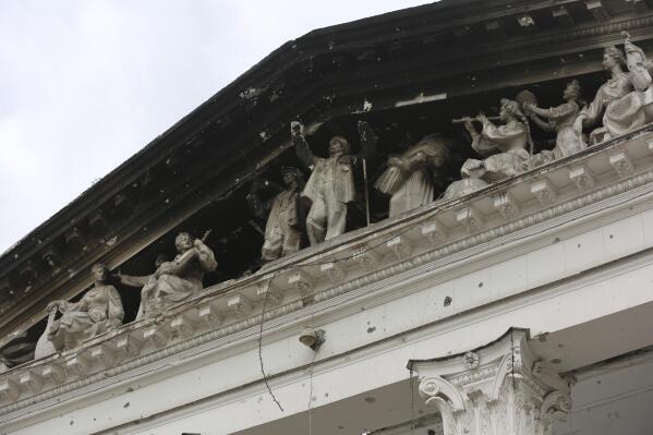 FILE - Part of the Donetsk Academic Regional Drama Theatre in Mariupol, Ukraine, is charred following a bombing on March 16, 2022, when the theater was used as a shelter, in an area now controlled by Russian forces Monday, April 4, 2022. The bombing of the theater stands out as the war's single deadliest known attack against civilians to date. (AP Photo/Alexei Alexandrov, File)