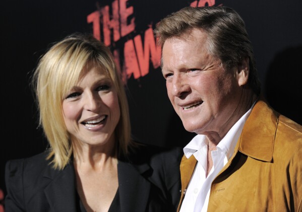 FILE - Tatum O'Neal, left, a cast member in "The Runaways," and her father, actor Ryan O'Neal, pose together at the premiere of the film in Los Angeles, Thursday, March 11, 2010. Ryan O’Neal, who was nominated for an Oscar for the tear-jerker “Love Story” and played opposite his precocious daughter Tatum in “Paper Moon,” has died. O’Neal's son Patrick said on Instagram that his father died Friday, Dec. 8, 2023. (AP Photo/Chris Pizzello, File)