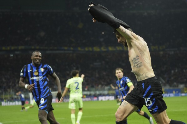 Inter Milan's Francesco Acerbi celebrates after scoring during the Champions League semifinal second leg soccer match between Inter Milan and Barcelona at San Siro stadium in Milan , Italy, Tuesday, May 6, 2025. (AP Photo/Antonio Calanni)
