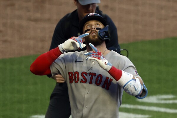 Boston Red Sox's Trevor Story reacts after hitting a two-run home run during the fourth inning of a baseball game against the Atlanta Braves, Friday, May 30, 2025, in Atlanta. (AP Photo/Butch Dill)