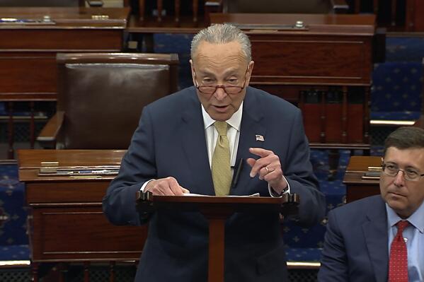 In this image from Senate Television, Senate Majority Leader Chuck Schumer of New York, speak on the Senate floor, Wednesday, May 25, 2022 at the Capitol in Washington.  Schumer has quickly set in motion a pair of firearms background check bills in response to the school massacre in Texas. But the Democrat acknowledged Wednesday the refusal for years of Congress to pass any legislation aiming to curb a national epidemic of gun violence.  (Senate Television via AP)
