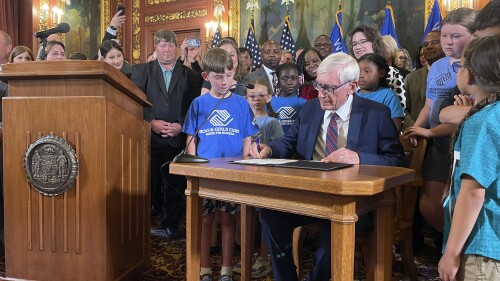 Democratic Wisconsin Gov. Tony Evers signed a two-year spending plan into law, Wednesday, July 5, 2023, in Madison, Wis. The budget was authored by Republicans who control the Legislature, but Evers used his partial veto powers to revise portions of it. (AP Photo/Harm Venhuizen)