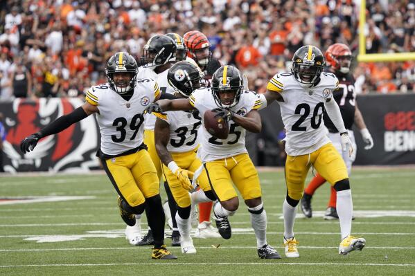 Pittsburgh Steelers cornerback Ahkello Witherspoon (25) celebrates an interception during the second half of an NFL football game against the Cincinnati Bengals, Sunday, Sept. 11, 2022, in Cincinnati. (AP Photo/Joshua A. Bickel)