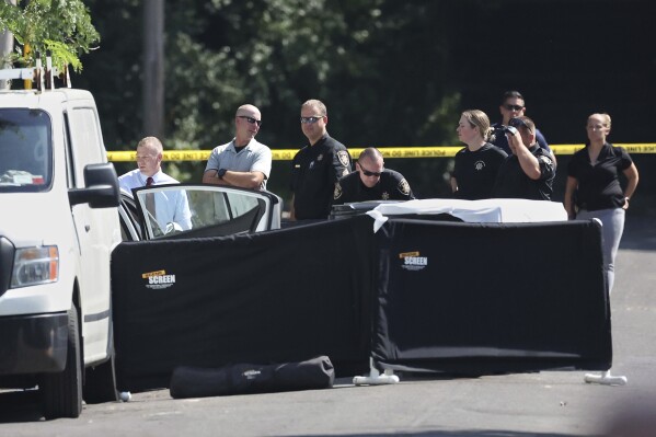 FILE - Onondaga County sheriff's officers work at the scene of a shooting in the Syracuse, N.Y., suburb of DeWitt, N.Y., Wednesday, Sept. 6, 2023. New York's New York's attorney general released a video Tuesday, Sept. 12, 2023, of a county sheriff's deputy firing a gun into a fleeing car and fatally wounding two teenagers, raising questions about whether the officer needed to use deadly force to avoid being run over. (Dennis Nett/The Post-Standard via AP, FIle)