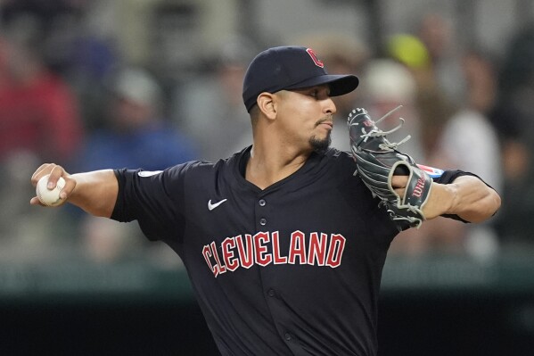 Cleveland Guardians pitcher Carlos Carrasco throws during the first inning of a baseball game against the Texas Rangers in Arlington, Texas, Wednesday, May 15, 2024. (AP Photo/LM Otero)