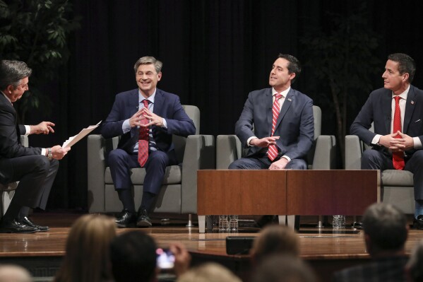 From left, Mike Kaylmyer moderates a Republican primary Senate forum between State Rep. Matt Dolan, Ohio Secretary of State Frank Larose, and Bernie Moreno, Feb. 19, 2024, in the TLB Auditorium at the University of Findlay in Findlay, Ohio. A fractious three-way Republican primary for the chance to unseat Democratic U.S. Sen. Sherrod Brown this November is culminating in Ohio, where candidates are divided more over their pasts than their policy positions. Moreno, LaRose and Dolan all favor some level of federal abortion restriction and tough treatment of immigrants lacking permanent legal status, among similar stances. It’s whether voters can trust them at their words that the three and their deep-pocketed allies are disputing ahead of Ohio’s March 19 primary. (Jeremy Wadsworth/The Blade via AP, file)