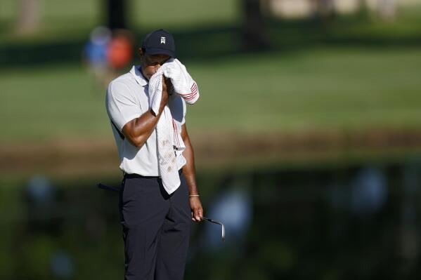Tiger Woods wipes his face on the 11th green during a practice round for the PGA Championship golf tournament at Southern Hills Country Club on Monday, May 16, 2022, in Tulsa, Okla. (Mike Simons/Tulsa World via AP)
