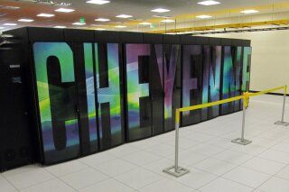FILE - In this Aug. 8, 2017, file photo, is the current supercomputer named Cheyenne at the NCAR-Wyoming Supercomputing Center near Cheyenne, Wyo. A new supercomputer in Wyoming will rank among the world's fastest and help study phenomena including climate change, severe weather, wildfires and solar flares. Houston-based Hewlett Packard Enterprise won in bidding to provide the $35-$40 million machine for a supercomputing center in Cheyenne, the National Center for Atmospheric Research in Boulder, Colo., announced Wednesday, Jan. 27, 2021. (AP Photo/Mead Gruver, File)