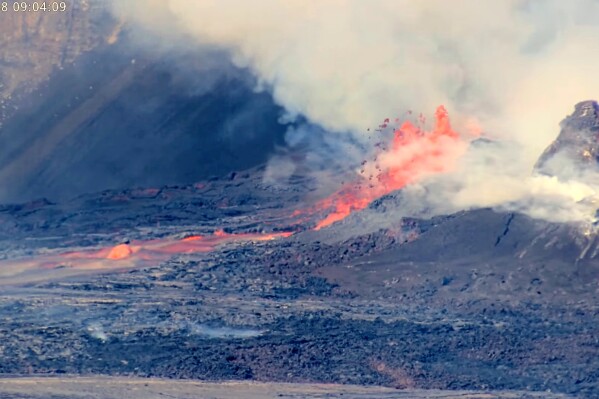 This image from webcam footage provided by the United States Geological Survey (USGS) shows lava shooting up high during an ongoing eruption of Kilauea volcano inside Hawaii Volcanoes National Park on Tuesday, April 8, 2025 (U.S. Geological Survey via AP)