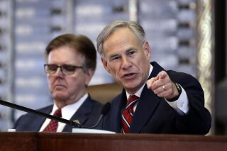 FILE - In a Tuesday, Feb. 5, 2019 file photo, Texas Gov. Greg Abbott, right, gives his State of the State Address as Texas Lt. Gov. Dan Patrick, left, listens in the House Chamber, in Austin, Texas. Texas Gov. Greg Abbott doesn’t flash the White House ambitions of his predecessors, but the Republican has built his own distinction by taking in more donor cash than any governor in history. (AP Photo/Eric Gay, File)