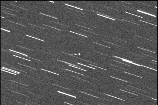 This image provided by Virtual Telescope Project out of Italy shows a single 180-second exposure asteroid that was approaching Earth, about 4 million kilometers, Thursday, Jan. 31, 2024. Astronomers say an asteroid as big as a skyscraper will pass within 1.7 million miles of Earth on Friday. There's no chance of it hitting us since it will pass seven times the distance from Earth to the moon. (Virtual Telescope Project via AP)