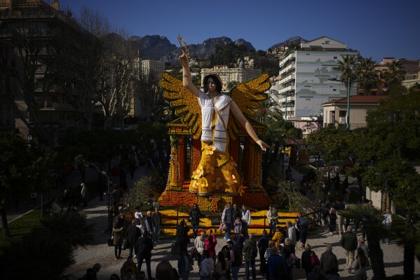 A sculpture of Nike the Greek god of victory made with lemons is pictured during the 90th Olympia in Menton edition of the Lemon Festival in Menton, southern France, Saturday, Feb. 17, 2024. (AP Photo/Daniel Cole)